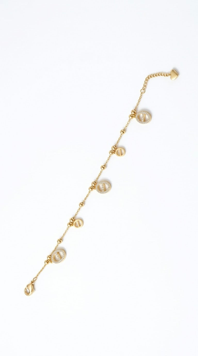 BRACELET CHAÎNE À BILLES DORÉ PENDENTIF MAILLE MARINE STRASS - ÉGLANTINE